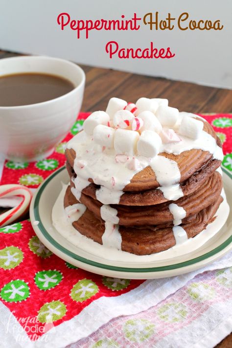 Light & fluffy pancakes are infused with lots of hot cocoa & peppermint flavor, and then topped with a super simple marshmallow cream topping in these Peppermint Hot Cocoa Pancakes. Cocoa Pancakes, Light Fluffy Pancakes, Light And Fluffy Pancakes, Pancakes Pancakes, Peppermint Hot Cocoa, Crepe Cakes, Christmas Morning Breakfast, Mille Crepe, Marshmallow Cream