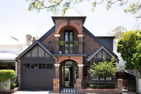 8 Siding Colors That Go Beautifully With Red Brick Exteriors | Hunker Red Brick Black Garage Door, Stucco And Red Brick Exterior, Red Brick With Black Siding, Dark Brown Brick House Exterior, Colors That Go With Red Brick, Brick Homes Exterior, Brick Houses Exterior, Brown Brick House Exterior, Brick Exterior Colors Schemes