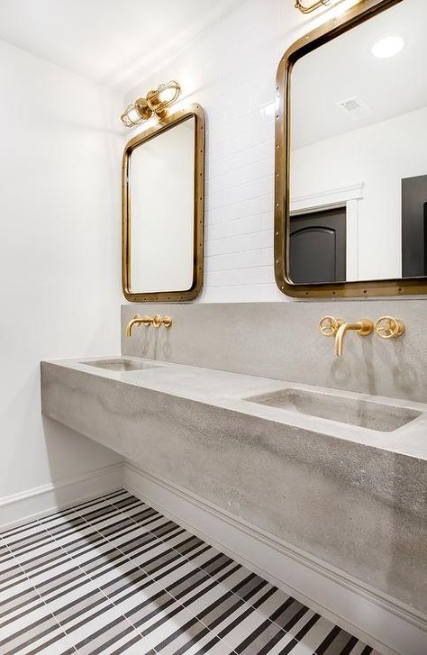 White, gray, and black striped floor tiles lead to a concrete dual floating washstand paired with brushed gold faucets mounted to a concrete backsplash. Cement Bathroom, Concrete Vanity, Creek House, Cement Tile Shop, Concrete Bathroom, Trough Sink, Concrete Sink, Young House Love, Transitional Bathroom