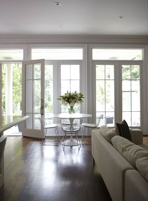 Suzie: HGTV - Wall of French doors & transom windows, Marble Saarinen Dining Table and Bertoia ... French Doors With Transom, Saarinen Dining Table, French Doors Patio, Transom Windows, Contemporary Dining Room, Living Room Windows, French Doors Interior, Patio Doors, Living Room Wall