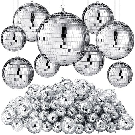 PRICES MAY VARY. Sufficient Quantities: you will receive 200 pieces of mini disco balls, including 60 pieces 2 cm/ 0.79 inches in diameter, 60 pieces 4 cm/ 1.57 inches, 20 pieces 8cm/ 3.15 inches, 6 pieces 10 cm/ 3.94 inches and 4 pieces 15 cm/5.91 inches, which are sufficient for you to use and replace on different occasions, satisfying your different decoration demands and making your parties bright Reliable to Use: the disco ball decorations are made of foam stuff inside and silver glass cove Disco Ball Decorations, Silver Disco Ball, Christmas Mirror, Disco Party Decorations, Prom Theme, Ball Lamps, Ball Decorations, 70s Disco, Mirror Ball