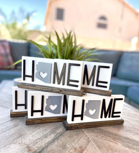 This wood shelf sitter sign is approx 8.5" wide by 4" tall and will look PERFECT in your desert/southwestern decor! Comes in 2 designs, the cactus or state silhouette, please choose at checkout and leave the state name in the order notes!  Shelf sitter comes attached to the wood base so it stands up on its own without having to lean. Like the style but it's not exactly what you are looking for? Don't hesitate to reach out and ask for other creative ideas or inspiration. I'm more than happy to he Sublimation Wood Signs, Laser Wood Signs, Scroll Saw Signs, Wood Signs Ideas, Wood Cactus, Laser Products, Glow Projects, Small Projects Ideas, Cnc Machine Projects