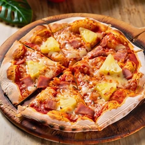 Experience the tropical taste of Hawaii with this traditional Hawaiian Pizza recipe, a delightful blend of sweet pineapple, savory ham, and melted cheese atop a golden crust. This pizza brings a unique twist to the classic Italian favorite, incorporating flavors that transport you straight to the sunny beaches of Hawaii. Preparation Time: 15 minutes (excluding dough preparation) Cooking Time: 15 minutes Resting Time: N/A Total Time: 30 minutes Serving: 4 Ingredients: - Pizza dough (homema... Pizza Hawaiian, Pizza With Pineapple, Hawaii Pizza, Hawaiian Pizza Recipe, Ham And Pineapple Pizza, Pineapple Pizza, Italian Favorites, Classic Pizza, Pizza Lovers