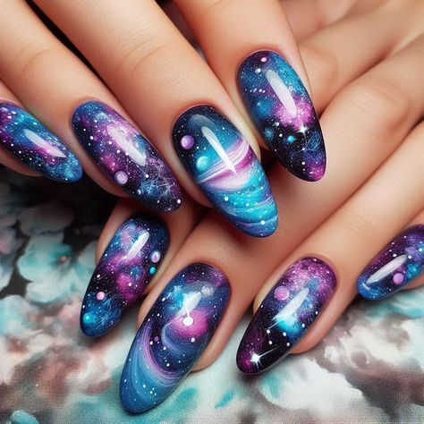 Explore the infinite wonders of the universe with our stunning galaxy nail art designs. Each nail becomes a tiny canvas, capturing the swirling colors of nebulae, twinkling stars, and the mysterious depths of space. Perfect for those who love a bold, out-of-this-world look, our long-lasting, high-shine finish ensures your nails remain a dazzling display of cosmic beauty. Let your nails shine like the stars with these mesmerizing galaxy designs. Nails Inspiration Galaxy, Easy Galaxy Nails, Space Nails Galaxy, Galaxy Nail Designs Universe, Galaxy Manicure, Nail Art Galaxy, Purple Nails Galaxy, Nails Space, Diy Valentine's Nails