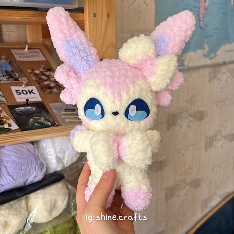 Sylveon fuzzy baby 🥰 The pattern has lost of pieces to crochet but definitely worth the work and effort 🤭 Pattern by @jennyplushies #pokemon #sylveon #kawaii #plush #crochet #amigurumi Sylveon Crochet Pattern, Sylveon Plush, Knitting Kawaii, Grandma Hobbies, Plushies Pattern, Pokemon Sylveon, Pokémon Crochet, Pokemon Crochet, Pokemon Crochet Pattern