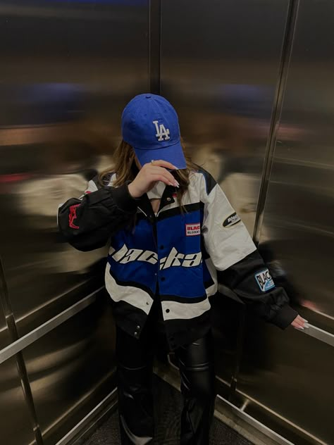 Base Ball Cap Outfit Black Women, Blue Racer Jacket Outfit, Racer Style Outfit, F1 Aesthetic Outfit, Blue Baseball Cap Outfit, La Dodgers Hat Outfit, Racer Girl Outfit, Dodgers Hat Outfit, Blue Racer Jacket