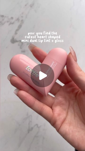 tracy on Instagram: "I found THE mini lippie for all the coquette girlies 🎀 This @lottielondon twisted heart lippie is dual ended. One side is a strong cherry lip tint (it literally does not budge) and on the other is a clear lip gloss. Great for layering both for color + shine or just adding shine to your lips 🫶 Available at Walmart and CVS 🛒 Nail press on set is from @nailo_nyc #lottielondon #coquettegirl #coquetteaesthetic #coquettecore #coquettestyle #lipgloss #liptint #coquette #cutemakeup #cuteaesthetic #heartlipgloss #lipglossmini #walmartfinds" Overline Cupids Bow Lips, Lip Fillers Cupids Bow, Coquette Lip Products, Lipgloss Coquette, Coquette Girlies, Heart Shaped Lip Gloss, Lottie London, Tinted Gloss, Twisted Heart