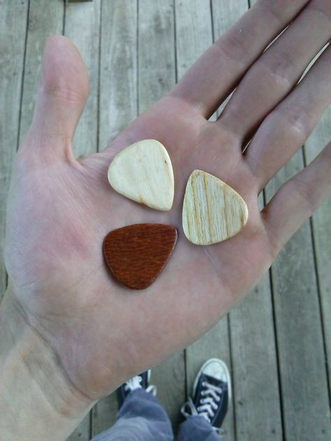 Wood Guitar Picks Guitar Picks Diy, Music Instruments Diy, Wood Guitar Pick, Guitar Crafts, Homemade Musical Instruments, Wooden Jewelery, Wooden Work, Guitar Pick Jewelry, Wood Guitar