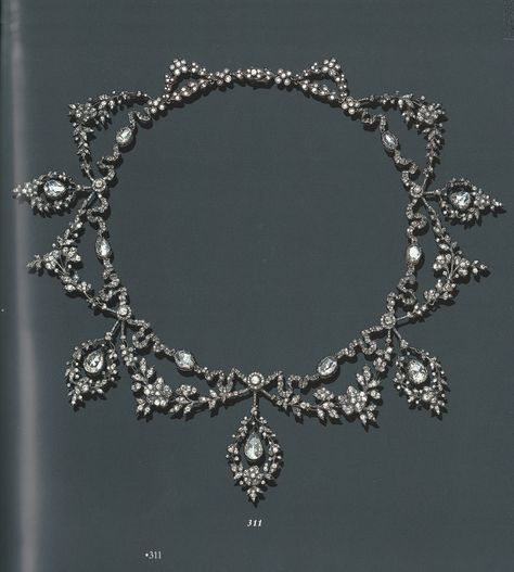 AN ANTIQUE DIAMOND GARLAND NECKLACE, CIRCA 1890. The front suspending a graduated series of five pear-shaped rose-cut diamonds, each within independent drop-shape old mine-cut garland frames, accented by old mine-cut diamond swags, joined to a similarly-set scrolling ribbon motif chain, mounted in gold and silver. Antique Diamond Necklace, Vintage Diamond Necklace, Edwardian Jewelry, Historical Jewellery, Jewelry Appraisal, Antique Necklace, Deco Jewelry, Antique Diamond, Victorian Jewelry