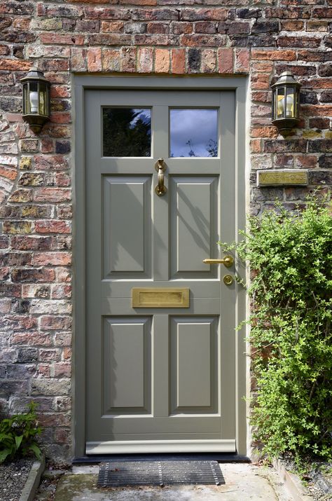 A beautiful Chalfont entrance door in Oxford Clay, with Polished Brass Unlacquered ironmongery from Samuel Heath. Manufactured in engineered Meranti Hardwood. Painted Entrance Door, British Front Doors, Wooden French Doors Entrance, Cottage Front Door Colors, Front Door Grey, Country House Front Door, Front Door Ironmongery, Entrance Door Color, Fully Glazed Front Door