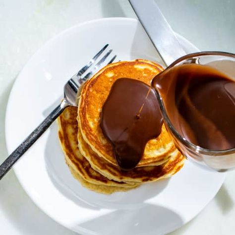 Malted Milk Pancakes with Chocolate-Hazelnut Syrup | Cook's Country Pancake Game, Malted Milk Powder, Milk Pancakes, Nutella Pancakes, Donut Toppings, Flavored Pancakes, Caramel Chocolate Bar, Cookie Toppings, Caramel Tart