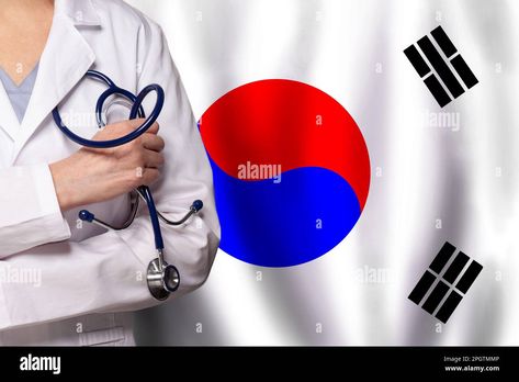 Download this stock image: Korean medicine and healthcare concept. Doctor close up against flag of Korea background - 2PGTMMP from Alamy's library of millions of high resolution stock photos, illustrations and vectors. Korea Background, Flag Of Korea, Korean Medicine, Close Up, Health Care, Medicine, High Resolution, Resolution, Flag