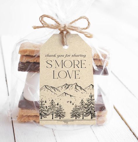 ♥ Add a rustic touch to your wedding or bridal shower with these charming "Mountain S'more Love" favor tags. Perfect for couples who share a love for the great outdoors, these tags are a delightful way to personalize your s'more-themed favors. Whether you're hosting a cozy mountain wedding or a woodland-themed bridal shower, these favor tags will make your guests feel appreciated. Non-editable, just print & party! ♥ Matching Items -----> https://bit.ly/4g48qBE WHAT YOU WILL RECEIVE: * PDF file w Smores Bridal Shower Theme, S’more Love Wedding Favor, Mountain Themed Wedding Shower Ideas, Wedding Smores Favors, Camping Style Wedding, Adventure Engagement Party, Bridal Shower Mountain Theme, Camp Bridal Shower Theme, Mountain Themed Bridal Shower Ideas