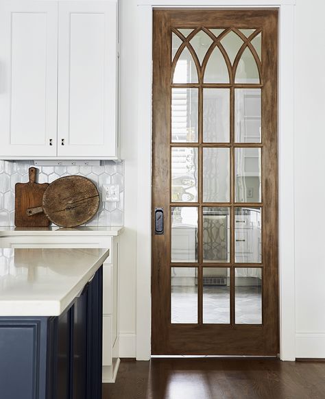 Antique pocket door with beautiful wood stain.  Interior design by @rebeccadriggsinteriors Stained Pocket Doors, Rustic Pocket Door, Antique Pocket Door, Unique Pocket Doors, Vintage Pocket Door, Stained Glass Pocket Doors, Wooden Pocket Doors, Antique Pocket Doors, Pocket Doors With Glass Panels