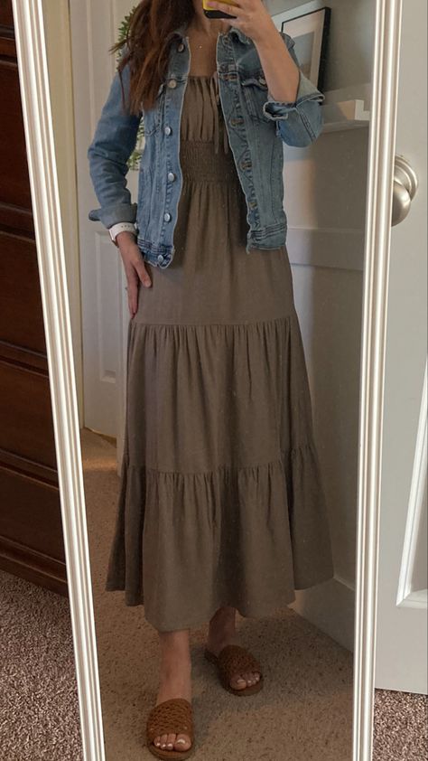 Denim jacket, taupe long sundress, camel sandals •Spring outfit •maxi dress •beige sundress Long Dress With Jean Jacket, Sundress Cardigan Outfit, Maxi Dress With Jacket Outfit, Beige Sundress, Khaki Dress Outfit, Dress With Jacket Outfit, Holy Girl Summer, Maxi Dress With Jacket, Teaching Wardrobe