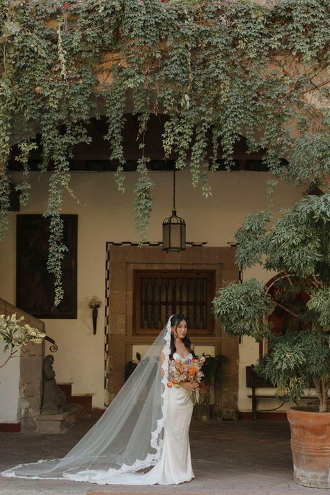 Add a touch of romance and Spanish glamour to your bridal attire with this luxurious mantilla cathedral veil. Combining a royal extra-long train with eyelash French lace edging, this veil will enchant both you and your guests with its billowing tulle and romantic lace. * Cathedral length veil or in a custom length  * Hand sewn from the most luxurious bridal illusion tulle * Mantilla style * 108'' width * In white, off-white, light ivory, ivory, or blush  * Add on silver and clear Czech beading or rhinestones to the lace for an extra charge (select "beaded lace trim" finish option upon check-out)  * The veil is attached to either a clear plastic hair comb or a metal hair comb (silver metal, gold metal, rose gold metal, or black metal) measuring 3'' in length for easy and secure placement in Cathedral Length Mantilla Veil, Mexican Wedding Vail, Long Wedding Veils Over Face, Spanish Style Veil, Lace Veil Cathedral, Mantilla Veil Wedding Spanish Style, Catholic Wedding Veil, Long Veil Wedding Hair, Cathedral Mantilla Veil