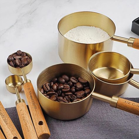 Aesthetic gold measuring cups and spoons with a wooden handle. Modern Utensils, Measuring Flour, Flour Scoop, Stainless Steel Measuring Cups, Measuring Cups And Spoons, Measuring Cups & Spoons, Measuring Cups Set, Baking Utensils, Liquid Measuring Cup