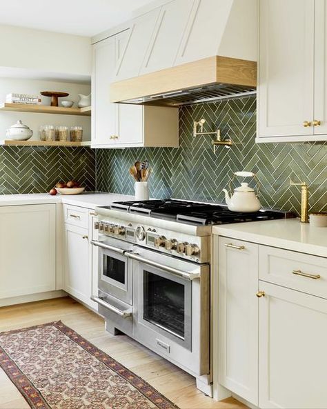 kitchen, cream cabinets with cream marble countertop, green tile backsplash, floor runner, stainless steel oven, gold hardware Green Kitchen Backsplash, Green Tile Backsplash, Green Backsplash, Kabinet Dapur, Herringbone Backsplash, White Kitchen Decor, Beige Kitchen, Gold Kitchen, Green Tile