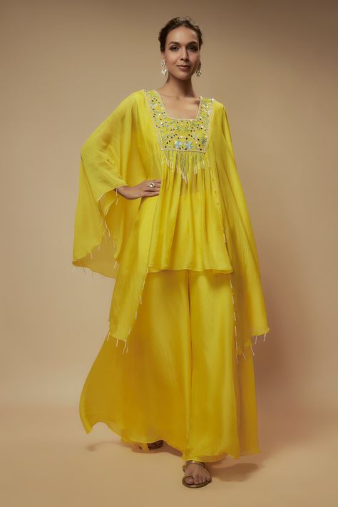 Shop for these amazing collections of Yellow Silk Organza Embellished Sequin Square High-low Tunic With Palazzo For Women by Keith Gomes online at Aza Fashions. Kurta Patterns, High Low Tunic, Yellow Silk, Tunic Pattern, Beaded Neckline, Cape Sleeves, Indo Western, Silk Organza, Sequin Beading