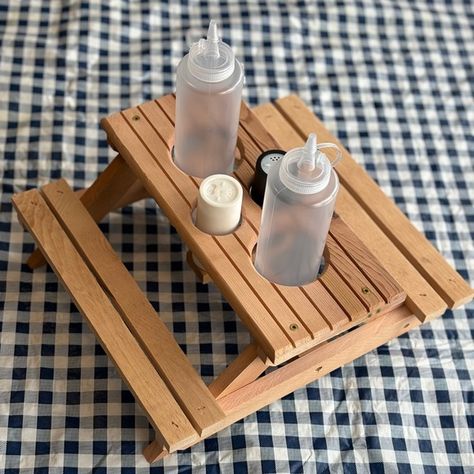 Picnic table condiment holder Picknick Table, Diy Picnic, Condiment Bottles, Diy Picnic Table, Summer Picnics, Condiment Holder, Backyard Bbq, Summer Picnic, Salt And Pepper Shakers