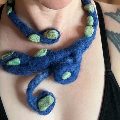 Needle felted wearable pieces have a very particular aesthetic…somewhere between alien & creepy and familiar & comforting. What I like most about this one is that it represents a shift for me…from thinking about trying out a new technique (needle felting) and project idea, to actually doing it. 10/10 recommend this stabby, soft craft 👁️‍🗨️💙 Eco-dyed wool Variscite Aluminum Flexible/sturdy wearable/ displayable / the good kind of weird 💙💚 #needlefelting #fiberart #wearablesculpture Abstract Needle Felting, Needle Felted Necklace, Weird Needle Felting, Fantasy Needle Felting, Wet Felted Clothing, Needle Felting, Fiber Art, Felt, Wool