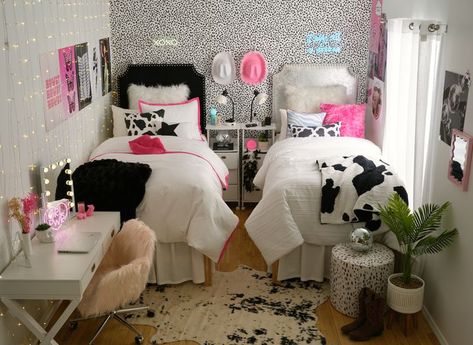 Obsessed with this disco cowgirl dorm room! Cow print + cowboy hats + pink + disco balls + neon signs + tons of organizational storage! can't wait to decorate my bedroom like this in college. dream dorm room inspo! Retro Cowgirl Room Decor, Cow Print And Pink Room, Disco Cowgirl Room Aesthetic, Disco Ball Dorm Room, Black And Pink Dorm Room, Disco Cowgirl Room Decor, Queen Bed Couch, Pink Cowgirl Bedroom, Cow Print Room Ideas