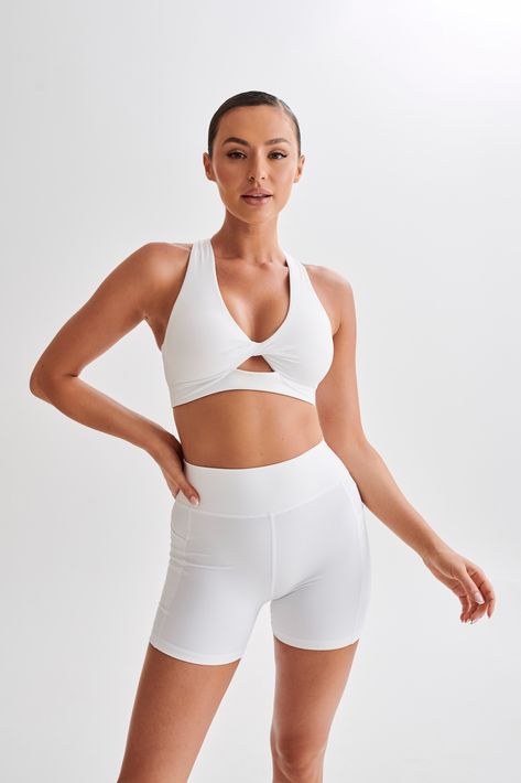 Supportive comfort.Meet the JACKIE Twist Crop Top, a pinnacle of style and support in the realm of activewear. The V neckline and captivating twist front detail exude modern sophistication, while the criss-cross strappy back adds a daring edge to your workout ensemble. Designed for high-impact activities, this crop top features an elastic under bust band, providing optimal support and a secure fit. Revel in the centre front cutout, a bold statement of confidence and style. With an inbuilt suppor Csb Activewear, Activewear Shoot, American Clothes, Twist Crop Top, Activewear Photoshoot, Egyptian Architecture, Female Pose, Test Shoot, Gym Fits