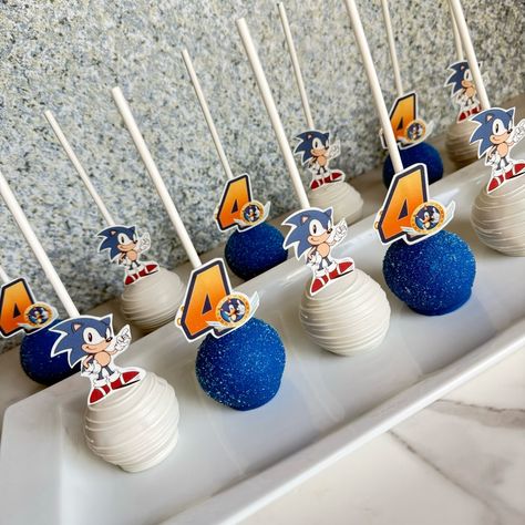 Sonic cake pops. Just realize movie #4 is coming soon to the theaters, are u guys ready?? Im so fan of Sonic, even more than my kids lol I guess im a big kid inside on me lol. #angiesweetcreations #soniccakepops #cakepops #ocbakers #chocolatediptreats #santaanatreats Sonic Cakes For Boys Diy, Sonic The Hedgehog Rice Krispie Treats, Sonic The Hedgehog Treats, Sonic 3 Birthday Party, Sonic The Hedgehog Birthday Party Food Ideas, Sonic Cake Pops, Sonic The Hedgehog Cupcakes, Sonic Desserts, Sonic Birthday Theme