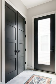 Large Entry Way Closet Ideas, Mudroom Closet Doors, Entrance Closet Doors, Foyer Closet Ideas, Mudroom Closet With Doors, Modern Black Interior Doors, Coat Closet Door Ideas, Mudroom Closets, Entrance Closet Ideas