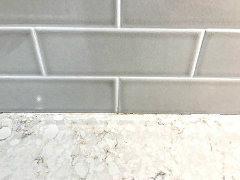 After 3 years of watching the grout along my kitchen counter top crumble, I finally made time to fix that problem. The general rule is that caulk should be used whenever tile meets a solid surface, like a tub or a counter. Caulk sealant has more flex and holds up longer than grout during little shifts in that area, from heat, cold, water, etc. BUT, luckily, it's a pretty quick fix, most of the time. Watch the video to see how easy it actually is.        You can see that the grout betw… Kitchen Grout, Copper Countertops, Diy Concrete Counter, Faux Marble Countertop, Elegant Fall Wreaths, Faux Fireplace Mantels, Thrift Store Makeover, Formica Countertops, Laminate Counter