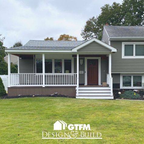 Work is finishing up on this covered front porch in Pompton Plains, New Jersey. This front porch was made using composite decking. #frontporch #porch #deck #decking #composite #compositedecking #coveredporch #roofextension #frontyard #homeimprovement #designandbuild Front Porch Ideas For Split Level Homes, Split Level House Front Porch, Split Level House With Front Porch, Split Level Front Porch Addition, Split Level Porch Ideas, Split Level With Front Porch, Split Level Front Porch, Split Level Front Porch Ideas, Composite Front Porch