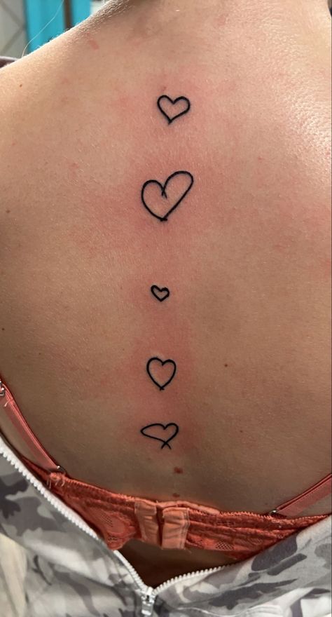 #tattoo #tattooideas #spinetattoosforwomen #spinetattooideas #hearts #hearttattoos Heart Spine Tattoos For Women, Tattoos On Heart Placement, Heart Back Tattoo Women, Heart Tattoo Spine, Heart Tattoo On Spine, Back Heart Tattoo, Hearts Down Spine Tattoo, Heart Back Tattoo, Heart Spine Tattoo