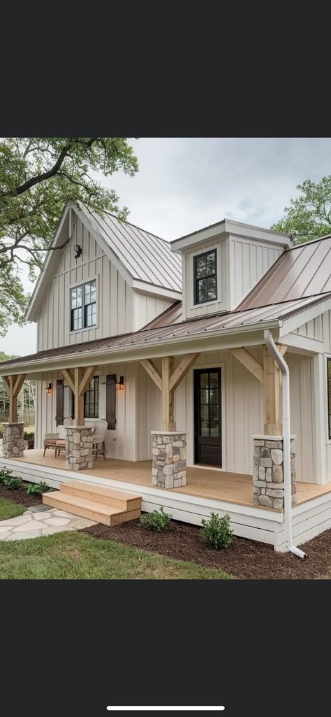 White House Silver Roof, White Farmhouse With Stone Exterior, Cream Barndominium Exterior, Off White Board And Batten Exterior, Beige Board And Batten Exterior, Cream Farmhouse Exterior, Brown Barndominium Exterior, White House With Stone, Exterior Board And Batten Siding