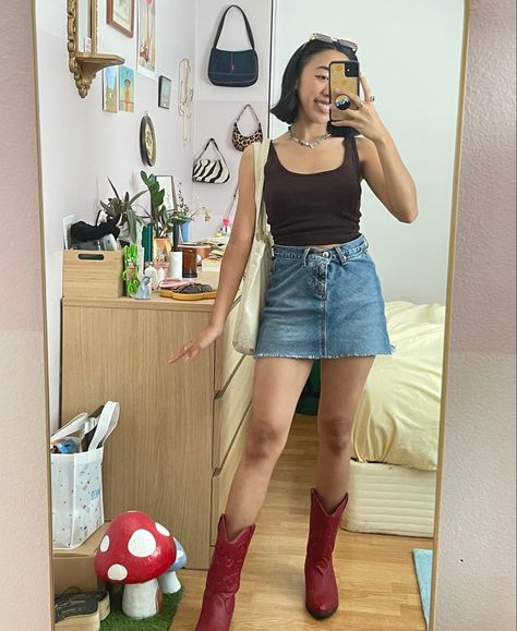 red cowboy boots paired with denim skirt fit Red Boots Outfit Summer, Cowboy Boots Styled, How To Wear Red Cowboy Boots, Skirt And Boots Outfit Spring, How To Style Red Cowboy Boots, Red Cowboy Boot Outfits, Outfits With Red Cowboy Boots, Cowboy Boots With Skirt, Indie Cowboy Boots Outfit