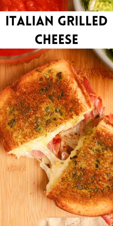 a cheesy Italian grilled cheese on a wood cutting board Pennini Sandwich, Tuscan Grilled Cheese, Italian Grilled Cheese Sandwich, Grilled Cheese With Prosciutto, Italian Sandwich Sauce, Grilled Italian Sandwiches, Sandwich And Soup Ideas, Tomato Grilled Cheese Sandwiches, Panini Sauce