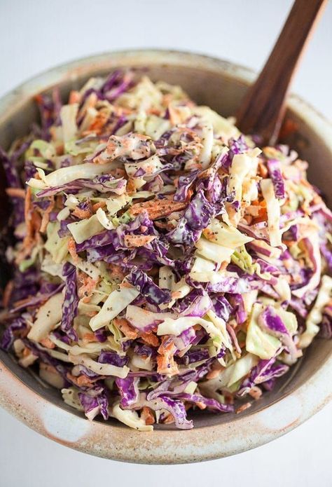 This Light and Crunchy Coleslaw recipe is easy to make and great for all your summer parties and picnics! It's full of red cabbage, green cabbage, and carrots. The veggies are tossed in a simple creamy homemade dressing. This dressing is tangy and full of classic flavors like Dijon mustard and celery seeds. This is the best vegetarian coleslaw! It's perfect as a side dish or for pulled pork. #coleslaw #light #healthy #recipes vegetarian #classic #easy Yummy Coleslaw Recipe, Crispy Cabbage, Crunchy Coleslaw, Side Dishes For Ribs, Classic Coleslaw, Tartiflette Recipe, Vegan Coleslaw, Coleslaw Dressing, Meat Dish