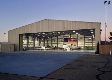 Hangar at twilight Private Hangar, Plane Hanger, Hangar Architecture, Airplane Hanger House, Airplane Hanger, Hangar Home, Warehouse Layout, Hangar Design, Hanger House