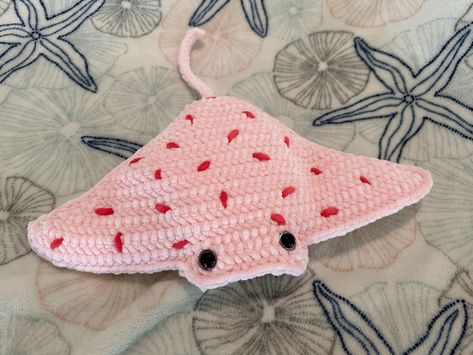 Introducing the handcrafted crochet manta ray, a unique blend of artistry and oceanic charm. Each manta ray is meticulously crocheted with soft, high-quality yarn, ensuring a durable yet cuddly feel. Its intricate detailing and vibrant colors bring a touch of the sea to any space, making it a perfect addition to your home decor or a thoughtful gift for marine enthusiasts. Dive into the world of artisanal craftsmanship and bring home a manta ray that's as captivating as it is cozy. Order yours today and add a wave of warmth to your life! Manta ray measures approximately 18ib n wingtip to wingtip, 15 inches from tail to nose. Contains parts not suitable for children under 3 years of age. Ray created by pattern from Theresa's Crochet Shop. Crochet Ray, Manta Ray Crochet Pattern Free, Crochet Manta Ray, Mantaray Crochet, Stingray Crochet, Stingray Blanket, Manta Ray, Crochet Shop, Crochet Amigurumi