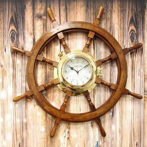 •	This Oversized Nautical Ship Wheel Wall Clock is 33.25" in diameter and 3.25" thick approximately. It weighs about 16.5 pounds.•	This Oversized Nautical Ship Wheel Wall Clock is made of wood and brass, individually hand crafted, painted and polished. Color Tone may vary slightly from pictures.•	Add this ship wheel clock to your home and it will instantly grab the attention of anyone who visits. Unique with a sleek and stylish finish, this clock makes the perfect nautical accent in any room. Th Wall Clock Decor, Boat Wheel, Wheel Clock, Coastal Modern, Ship Wheel, Clock Shop, Decor Fashion, Clock Decor, Clock Wall Decor