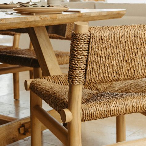 Inspired by Hacienda kitchens from rural Spain to colonial Mexico, this woven dining chair invites long, easeful meals and friendly gatherings. Mixing organic forms with high texture for a rustic, lived-in feel, the Hacienda chair’s generous handwoven natural seagrass seat finds support in a chunky dowel beechwood frame. Straw Chairs Dining Rooms, Tulum Dining Table, Mexican Dining Chairs, Oasis Interior, Rural Spain, Mexican Chairs, Mediterranean Furniture, Woven Chairs, Natural Dining Chairs