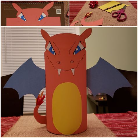 Charizard Pokemon Valentines Day Card Box.  Materials:  Cardstock paper:  orange for body and tail yellow for belly and flames,  blue for wings (optional for eyes- or just use sharpie like I did),  black (optional for eyes- or just use sharpie) White (I used the back of colored paper since it was white-- or use paint or whiteout) Red Wrapping Bow- cut in a few slices for flames.  I used a giant instant oatmeal box, (no lid- wrote his name inside the very top of container). Drew ears and eye shap Oatmeal Container Valentines Boxes, Snorlax Valentine Box Ideas, Pokemon Valentines Boxes For Boys, Pokémon Valentine Boxes, Pikachu Valentines Boxes, Valintine Box Ideas, Charizard Valentines Boxes, Charizard Valentine Box Ideas, Charmander Valentines Boxes