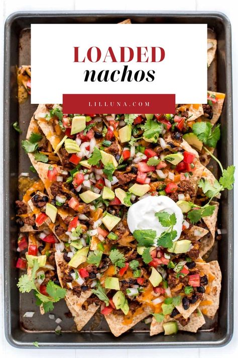 Piled high loaded nachos are the perfect game-day food or appetizer. They're easy to make and customize with your favorite nacho toppings! #loadednachos #nachos #nachotoppings #loadednachosrecipe #mexicanfood Loaded Nachos Recipe, Tomato Snacks, Nacho Toppings, Homemade Nachos, Nachos Recipe Easy, Lil Luna, Homemade Tortilla Chips, Loaded Nachos, Nachos Recipe