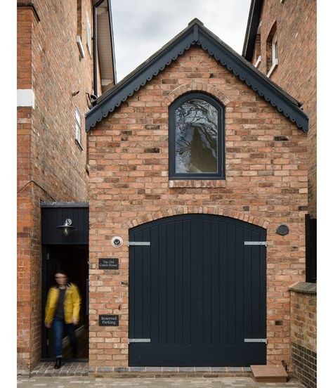 Faux timber doors, painted black, along with a brick facade help the dwelling blend with its surroundings: the Victorian homes of the Moseley neighborhood in Birmingham, UK. Tagged: Exterior, House, Brick Siding Material, and Gable RoofLine. Intervention Architecture, Brick Shed, Small House Bliss, Victorian Tiny House, Brick Siding, Mews House, Red Brick House, Narrow House, Brick Facade