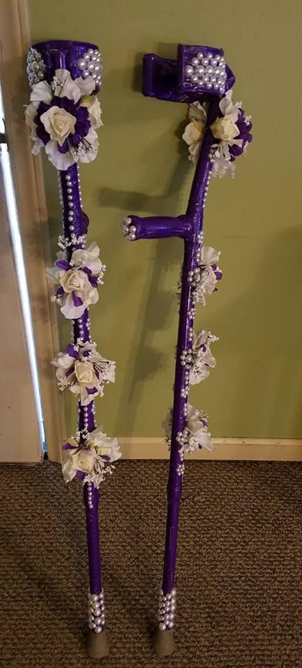 Crutches made with Purple duct tape, pearl beads, and flower corsages. Beads affixed with hot glue, corsages affixed by placing in sizing holes and hot glue. Babe With A Mobility Aid, Forearm Crutches Decorated, Disabled Fashion Cane, Cute Wheelchair Accessories, Mobility Aid Decoration, Decorated Mobility Aid, Rollator Decorations, Decorated Wheelchair, Forearm Crutches Aesthetic