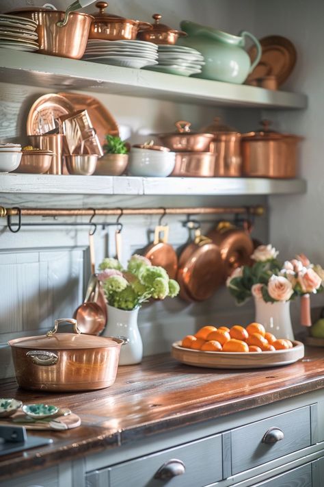 29 Stunning Copper Kitchen Decor Ideas That Will Wow Your Guests White Kitchen With Copper Accents, Kitchen Copper Accents, Copper Accents Kitchen, Copper Pans In Kitchen, Displaying Copper Pots And Pans, Copper Interior Design, Copper Cookware Display, Display Copper Pots In Kitchen, Vintage Copper Kitchen Decor