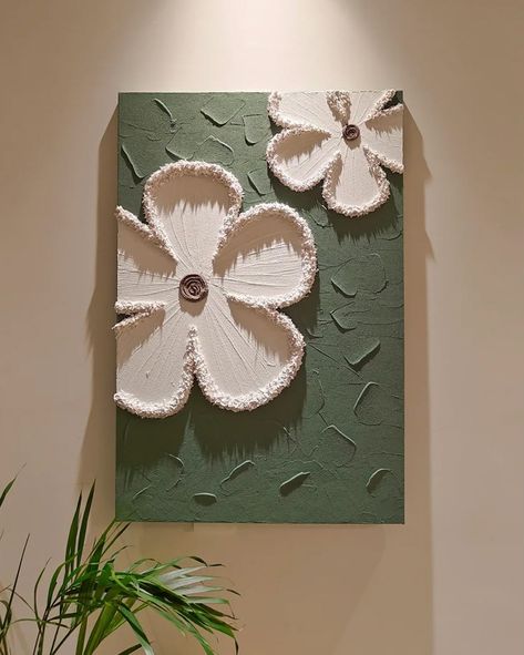 Each piece in the series is crafted on a cotton and linen canvas using acrylic paints to create textured, three-dimensional floral designs that pop against their backgrounds. 🔍 Product: Milly Flowers 3D Wall Art 👆 Tap the link in bio for more wall art pieces! . . . . . . . . . . . . . . . . . . #decorcrushing #interior4u #interior4inspo #sassyhomestyle #inspireushomedecor #housedecoration #mywestwingstyle #moderninteriordesign #dailydecordose #chicinteriors #homedesigns #lightingdesign #drea... White Cement Painting On Canvas, Pop Canvas Art, Clay Art For Wall Decor, Canvas Painting With Clay, Canvases On Wall, Clay On Canvas Art, 3d Art On Canvas, Pop Wall Design, Clay Art On Canvas