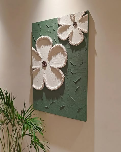 Each piece in the series is crafted on a cotton and linen canvas using acrylic paints to create textured, three-dimensional floral designs that pop against their backgrounds. 🔍 Product: Milly Flowers 3D Wall Art 👆 Tap the link in bio for more wall art pieces! . . . . . . . . . . . . . . . . . . #decorcrushing #interior4u #interior4inspo #sassyhomestyle #inspireushomedecor #housedecoration #mywestwingstyle #moderninteriordesign #dailydecordose #chicinteriors #homedesigns #lightingdesign #drea... Wall Paint Designs Creative Art Ideas, Clay On Canvas Art, Texture Art On Canvas, Textured Art Canvas, Wall Painting Canvas, Homemade Wall Art, 3d Canvas Art, Gold Art Painting, Flowers 3d