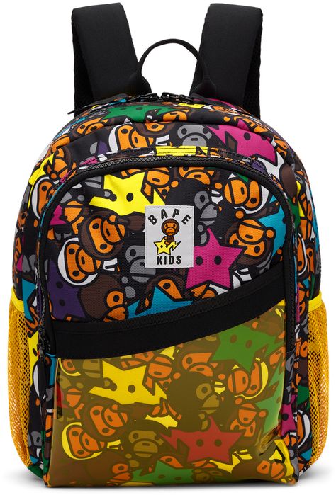 Canvas backpack in multicolor. · Graphic pattern printed throughout · Rolled webbing carry handle · Adjustable padded shoulder straps · Sternum strap · Logo patch at face · Zip and patch pocket at face · Mesh patch pocket at sides · Two-way zip closure · Fully lined · H14.5 x W10 x D4 Supplier color: Multi Bape Bookbags, Bape Backpack, Spray Ground Backpack, Cute Bookbags, Bape Bag, Y2k Backpack, Bape Star, Sprayground Backpack, Pretty Backpacks