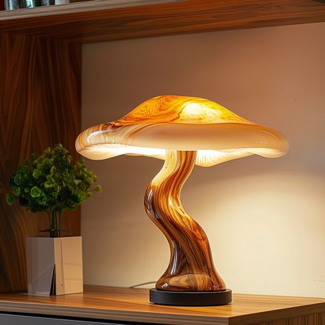 Introducing the “Fungi Glow Lamp,” inspired by the intricate beauty of mushrooms. Its eco-friendly design features a base resembling a mushroom stem and a translucent lampshade mirroring delicate mushroom caps, emitting a soft, enchanting glow. Each lamp is handcrafted, adding a touch of organic charm to any space. Conceptual AI Art Follow @ecosapiens for more! Mushroom Furniture, Mushroom Stem, Fantasy Cabin, Glow Lamp, Lamp Inspired, Mushroom Caps, Mushroom Lights, Unique Products Design, Stuffed Mushroom Caps