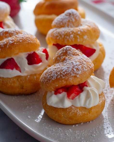 Strawberry Cream Puffs, or profiteroles, are a delightful tea-time treat. The simple choux pastry, filled with whipped cream and strawberries, makes a dessert perfect for any occasion. Love at first bite! #daysofjay #strawberries #mothersday #bakersofinstagram Strawberry Puff Pastry, Strawberry Cream Puffs, Whipped Cream And Strawberries, Choux Cream, Cream And Strawberries, Choux Buns, Love At First Bite, Food Tech, Choux Pastry